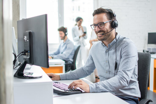 Guy in call, on pc, smiling, phone call, meeting, office,