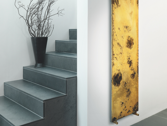 entrance area and stairs with a zehnder design radiator zehnder arteplano